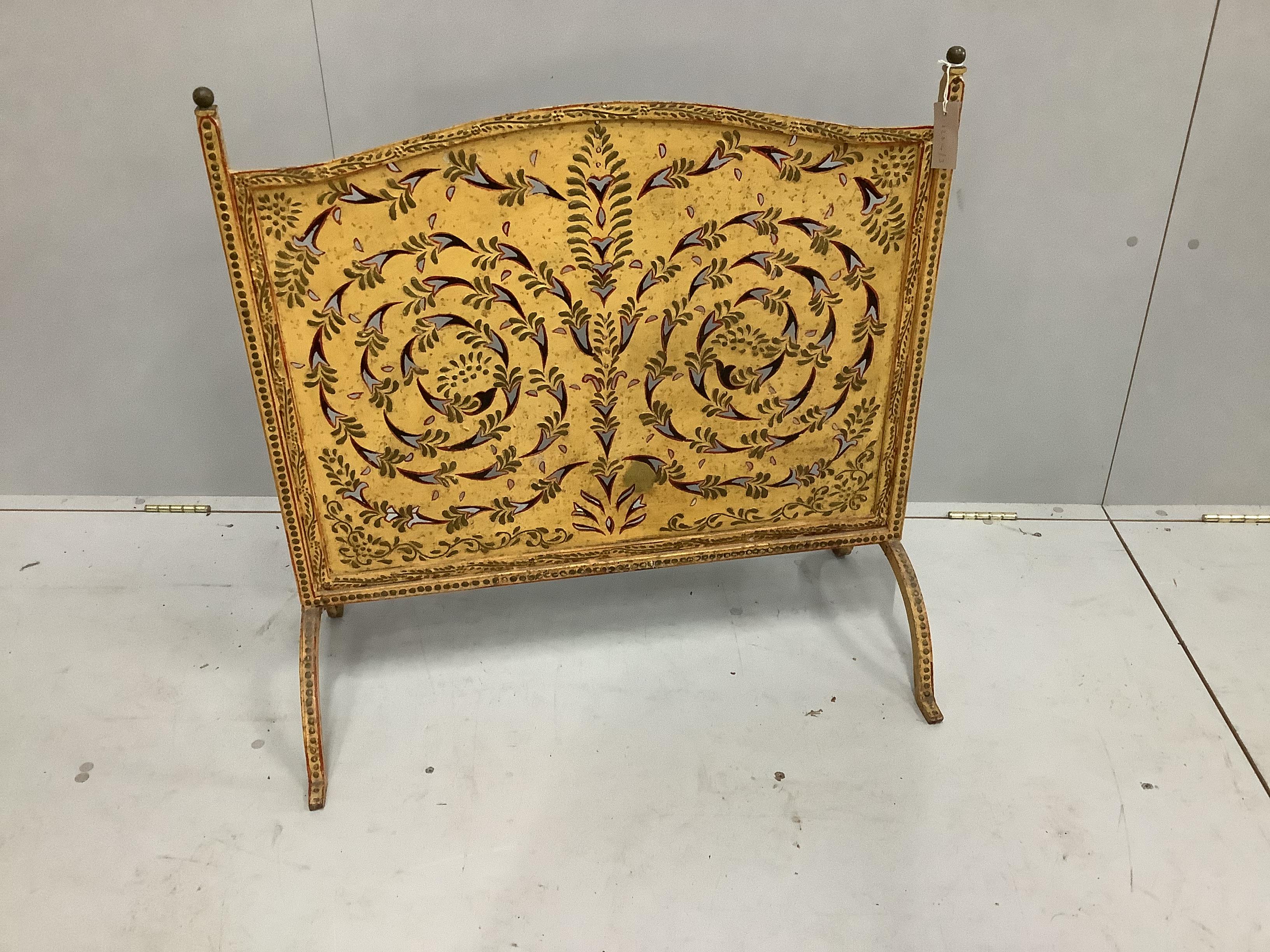 A pierced painted metal firescreen, width 80cm, height 80cm